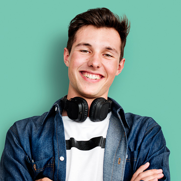 Young white man smiling with headphones